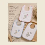 Terry towelling baby bibs in pink blue and cream with embroidered rabbit motifs