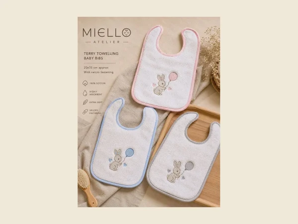 Terry towelling baby bibs in pink blue and cream with embroidered rabbit motifs