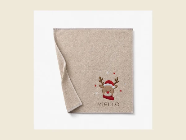 Baby towel in soft beige cotton with an embroidered reindeer motif