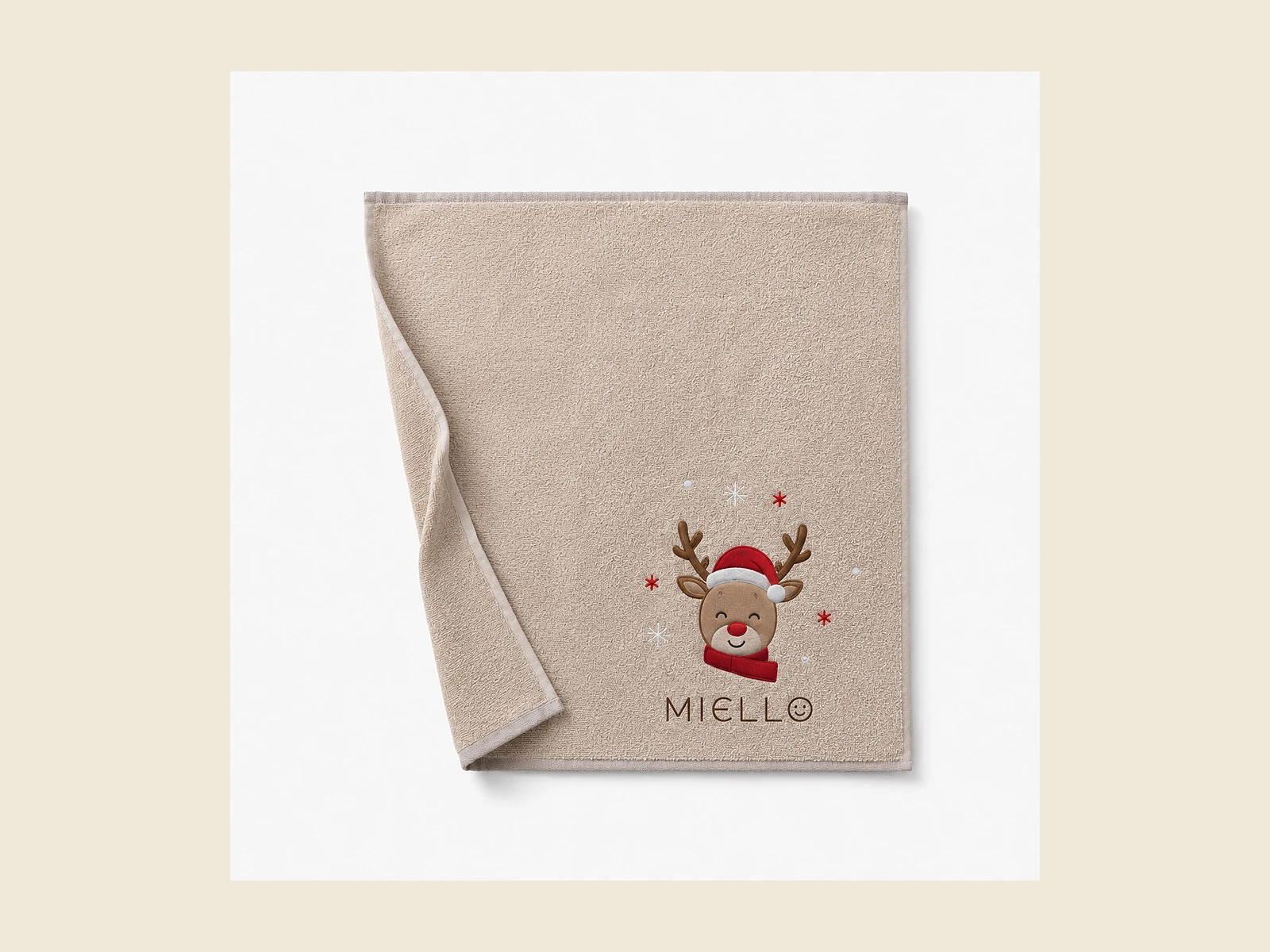 baby-towels Baby towel in soft beige cotton with an embroidered reindeer motif