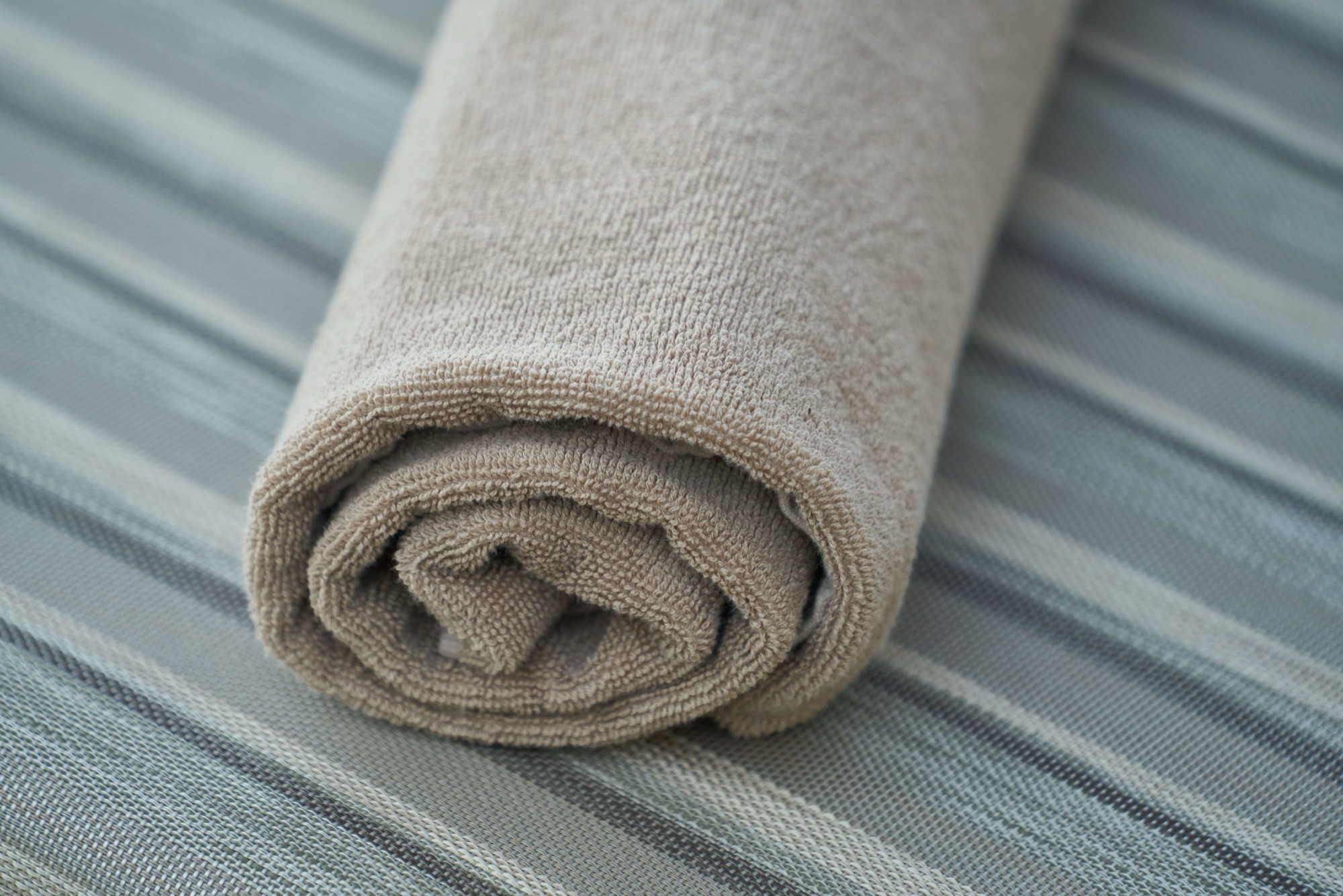 Embroidered and woven logo branding on hotel towels and robes — MONNEVA