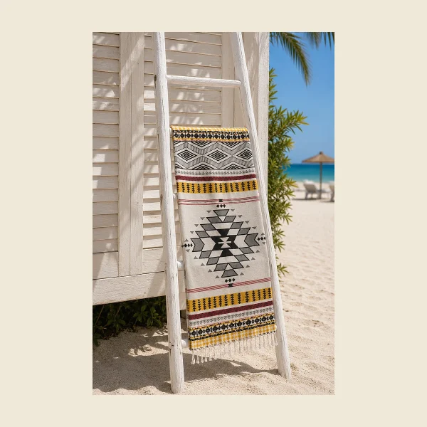 Jacquard peshtemal with a loom-woven geometric pattern displayed on a white ladder rail