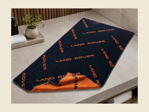 Folded promotional towels with embroidered branding for events and campaigns — MONNEVA