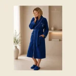 Navy terry bathrobe with piped shawl collar and MONNEVA embroidery — classic hotel weight