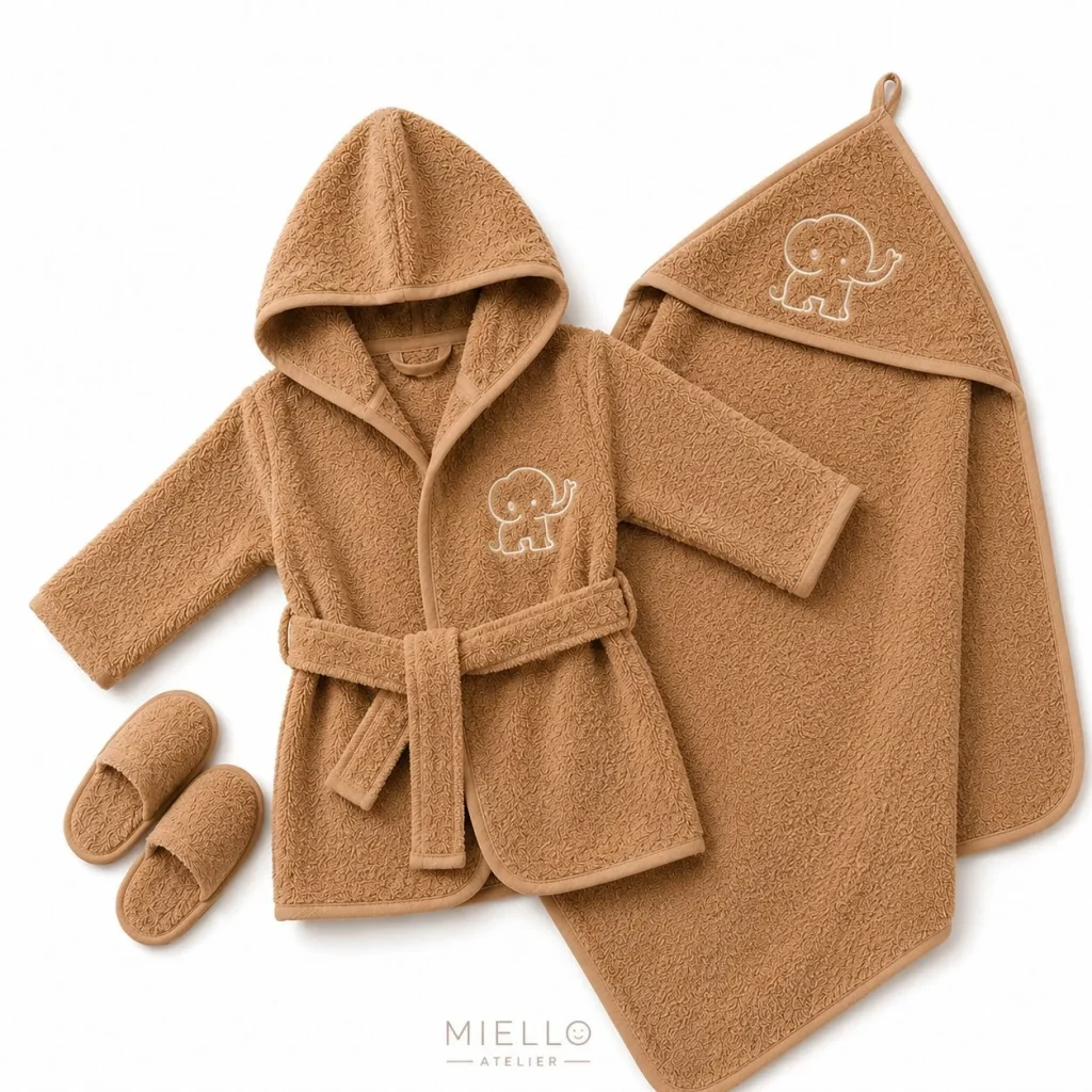 Caramel terry baby set — hooded bathrobe, hooded towel and slippers with an embroidered elephant motif, Miello Atelier